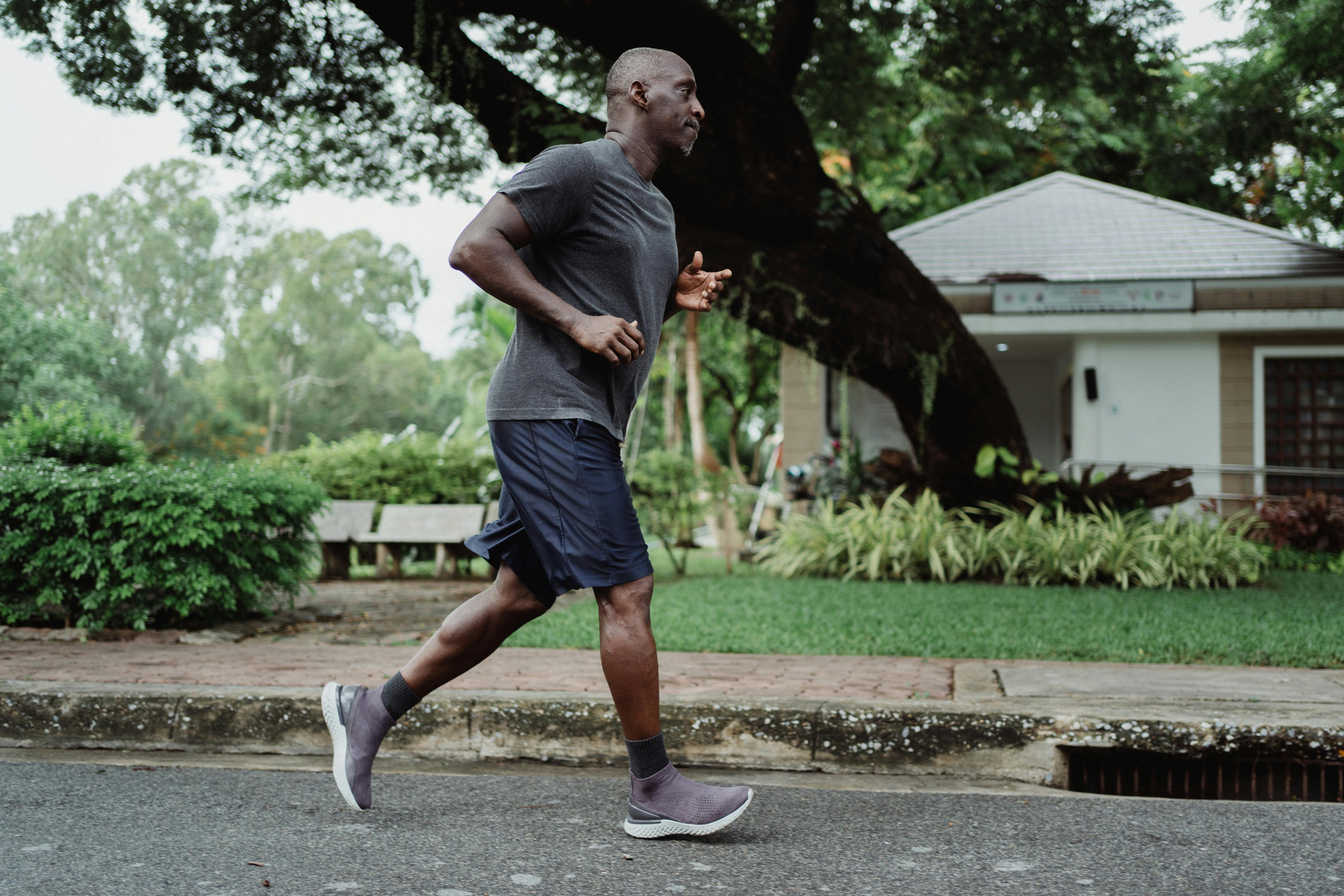 Active man running outdoors in a Florida neighborhood, representing an active lifestyle supported by Immunocal supplements