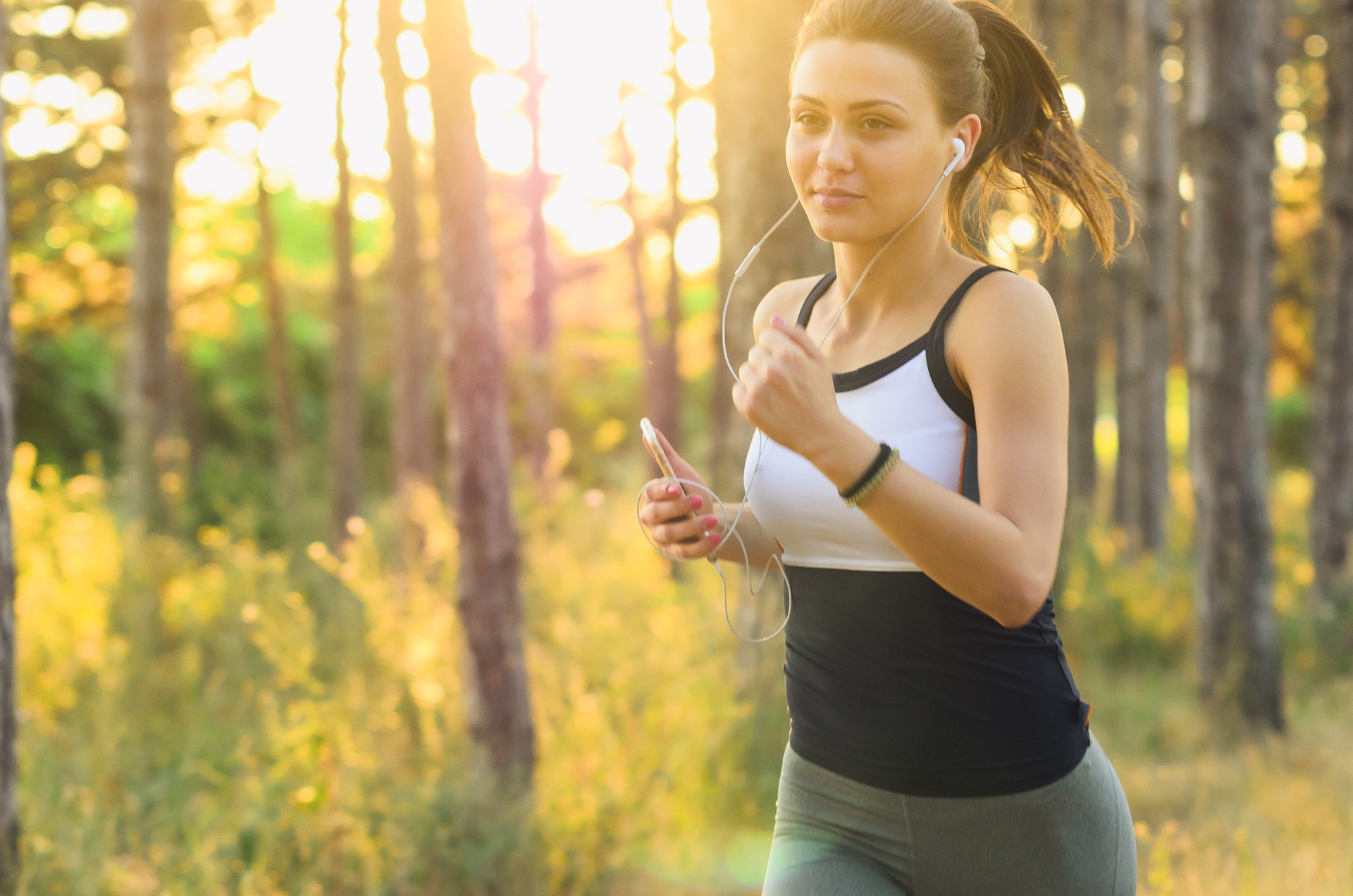 Active woman running outdoors representing a healthy lifestyle with Immunocal glutathione supplement in Florida